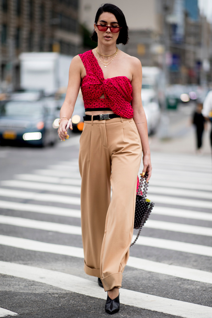 A one-shoulder top via street style.