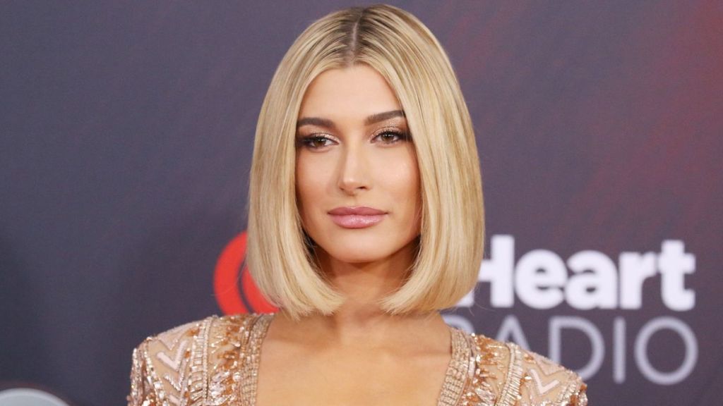 Hailey Baldwin arrives to the 2018 iHeartRadio Music Awards held at The Forum on March 11, 2018 in Inglewood, California. Hailey Bieber with blonde hair color prior to going brunette.