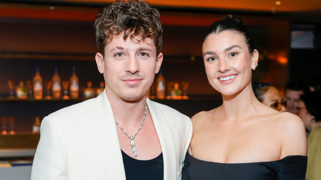 Charlie Puth and Brooke Sansone attend Interscope x Flipper's Roller Boogie Palace celebrating Dr. Dre's "The Chronic" with a star-studded party hosted by Usher and held in partnership with Meta and ORBIT Gum. Guests enjoyed plant-based bites from Tattooed Chef and toasts of PATRÓN EL ALTO at Hollywood Palladium on February 04, 2023 in Los Angeles, California.